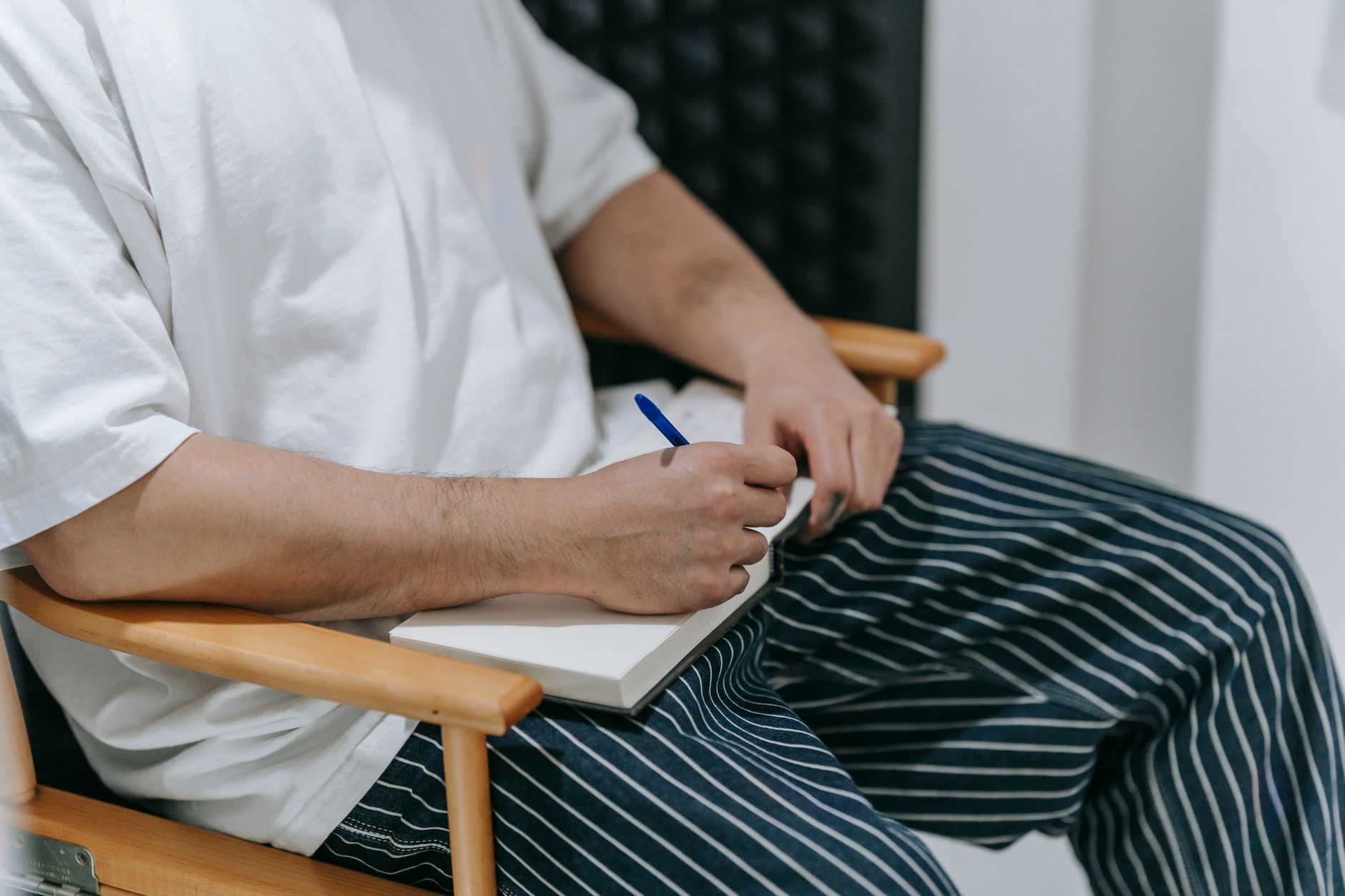 Travel writer taking notes in remote mountain lodge